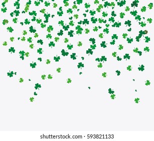 Flying leaves of clover different shades of green on a light background. Pattern for St. Patrick's Day. Rectangular, horizontal wallpaper. Vector illustration with copy space