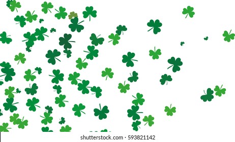 Flying leaves of clover different shades of green on a white background. Pattern for St. Patrick's Day. Rectangular, horizontal, narrow  banner. Vector illustration with copy space