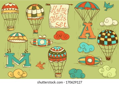 flying objects set with hot air balloons, parachute, airships, clouds, birds, letters A and M, colored in green background, vintage hand-drawn icons 