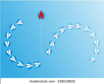 Flying origami. Red paper plane changing direction from white. New ideas. Different business concepts. Courage to risk. leadership. Go to the goal of financial business success and effort go to target