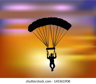 flying with the parachute in the sunset