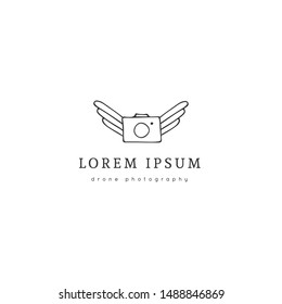 Flying photo camera. Aerial photography logo template. Hand drawn vector icon. For business identity and branding, for drone flight schools, photographers and drone shops.