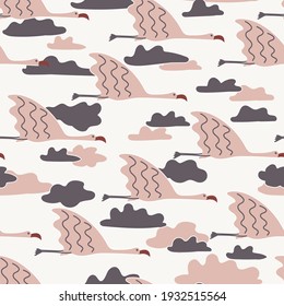 Flying pink flamingos in clouds vector seamless pattern - for fabric, wrapping, textile, wallpaper, background.