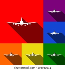 Flying Plane sign. Front view. Vector. Set of icons with flat shadows at red, orange, yellow, green, blue and violet background.