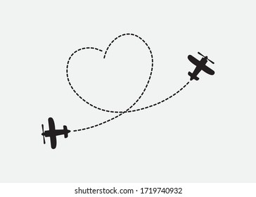 Aviones voladores con rutas con forma de corazón trazadas