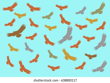Flying predatory birds in the sky.