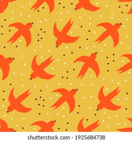 Flying red birds on yellow background. Hand drawn vector seamless pattern.