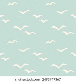 Flying seagulls pastel blue and cream block print style seamless pattern. Graphic flying bird silhouettes. Vintage coastal resort aesthetic background. Bird shape cutouts summer holiday design.