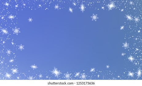 Flying snow background. Bbright, White, Shimmer, Glowing, Scatter, Falling on a Blue background. Festive decoration Christmas banner.
