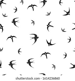 Flying swallows on a white background. seamless pattern. vector illustration