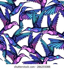 Flying tropical colorful hummingbirds with flowers seamless pattern.