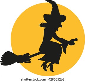 Flying witch silhouette at night in front of the moon