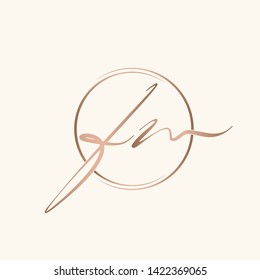 FM monogram in a circle frame.Typographic logo with calligraphic letter f and letter m.Lowercase lettering icon.Alphabet initials isolated on light fund.Rose gold metallic color.Elegant,beauty style.