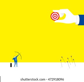 Focus! / A business man is shooting the last arrow.