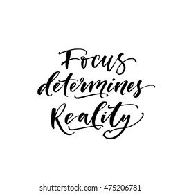 Focus determines reality card. Hand drawn motivational quote. Ink illustration. Modern brush calligraphy. Isolated on white background. 
