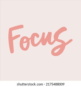 Focus - handwritten with a paintbrush word. 