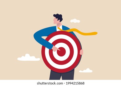 Focus on business target, setting goal for motivation, target audience for advertising or purpose for career development concept, businessman holding archer target or dashboard pointing at bullseye.
