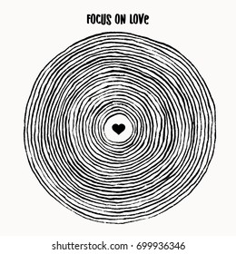 Enfoque en el amor - simple ilustración conceptual de círculos de pincel con corazón en el medio