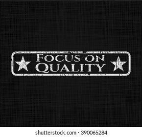 Focus on Quality chalkboard emblem written on a blackboard