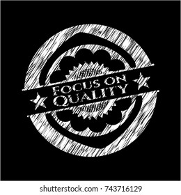 Focus on Quality chalkboard emblem on black board