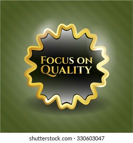 Focus on Quality golden emblem or badge