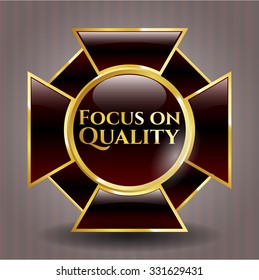 Focus on Quality golden emblem or badge