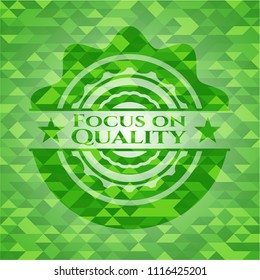 Focus on Quality green emblem with mosaic background