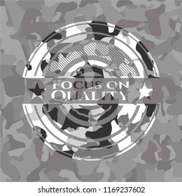 Focus on Quality on grey camo pattern