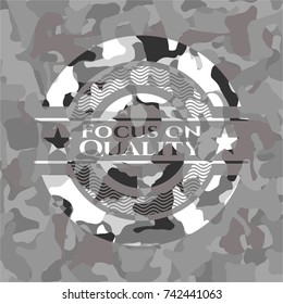 Focus on Quality on grey camo pattern