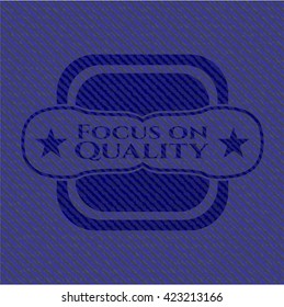 Focus on Quality jean or denim emblem or badge background