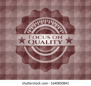 Focus on Quality red badge with geometric pattern background. Seamless.