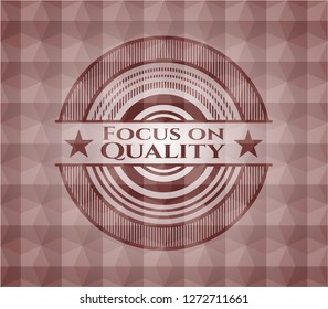Focus on Quality red emblem with geometric background. Seamless.
