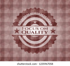 Focus on Quality red seamless emblem or badge with abstract geometric polygonal pattern background.