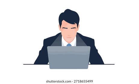 Focused businessman using a laptop at a desk