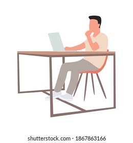 A focused man sits at a table and works in a laptop. The man is studying online. Online freelance work. Home time