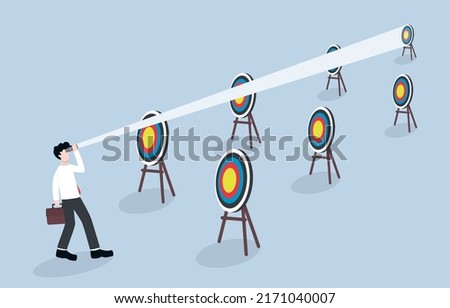 Focusing on long term business goal or investment, using more planing, more time, and more strategy for solid success concept. Confident businessman using binoculars to look at distant target.