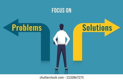 Focusing on solutions not on problems concept. Businessman standing at crossroad sign with the text