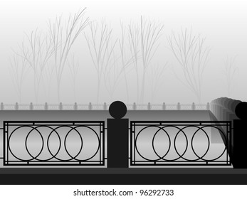 Fog in park with the river canal and the bridge.