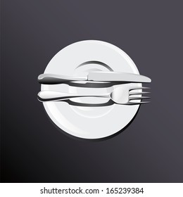 folded fork with a knife on a plate