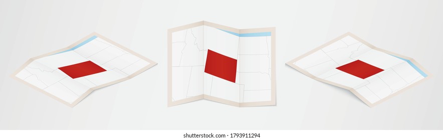 Mapa doblado de Wyoming en tres versiones diferentes. Mapa vectorial de Wyoming.