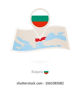 Folded paper map of Bulgaria with flag pin of Bulgaria. Vector Illustration