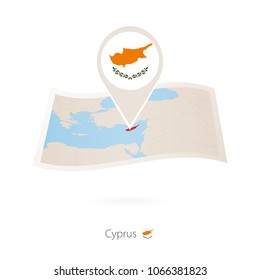 Folded paper map of Cyprus with flag pin of Cyprus. Vector Illustration