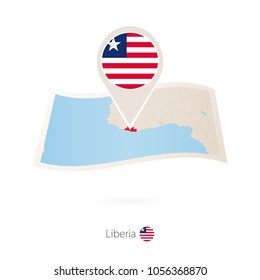 Folded paper map of Liberia with flag pin of Liberia. Vector Illustration