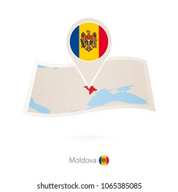 Folded paper map of Moldova with flag pin of Moldova. Vector Illustration