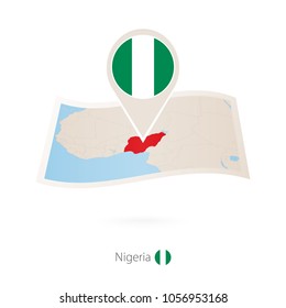 Folded paper map of Nigeria with flag pin of Nigeria. Vector Illustration