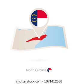 Folded paper map of North Carolina U.S. State with flag pin of North Carolina. Vector Illustration