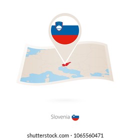 Folded paper map of Slovenia with flag pin of Slovenia. Vector Illustration