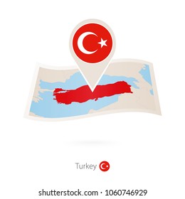 Folded paper map of Turkey with flag pin of Turkey. Vector Illustration