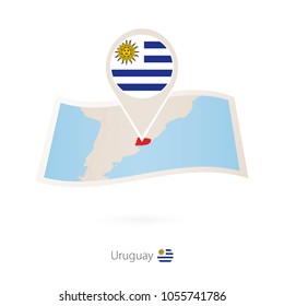 Folded paper map of Uruguay with flag pin of Uruguay. Vector Illustration