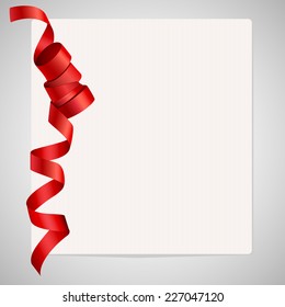 Folded satin ribbon on paper